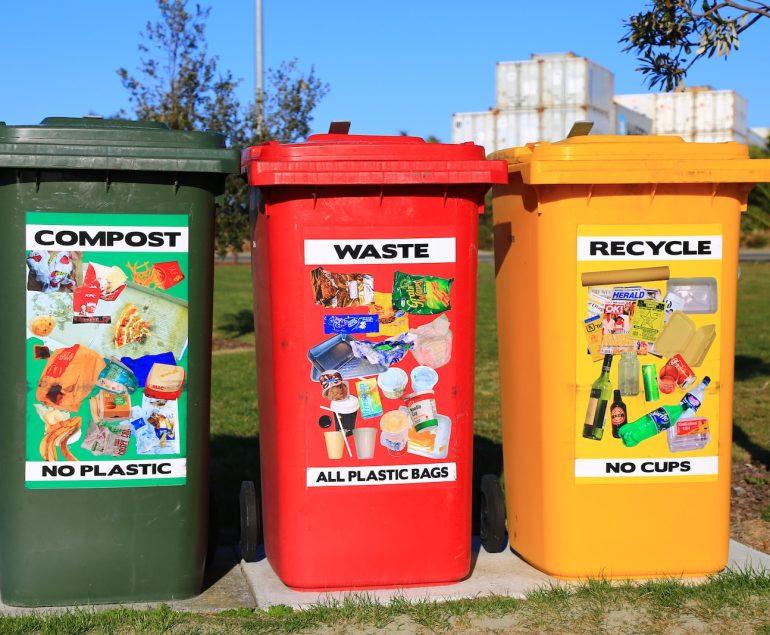 red yellow and green trash bins