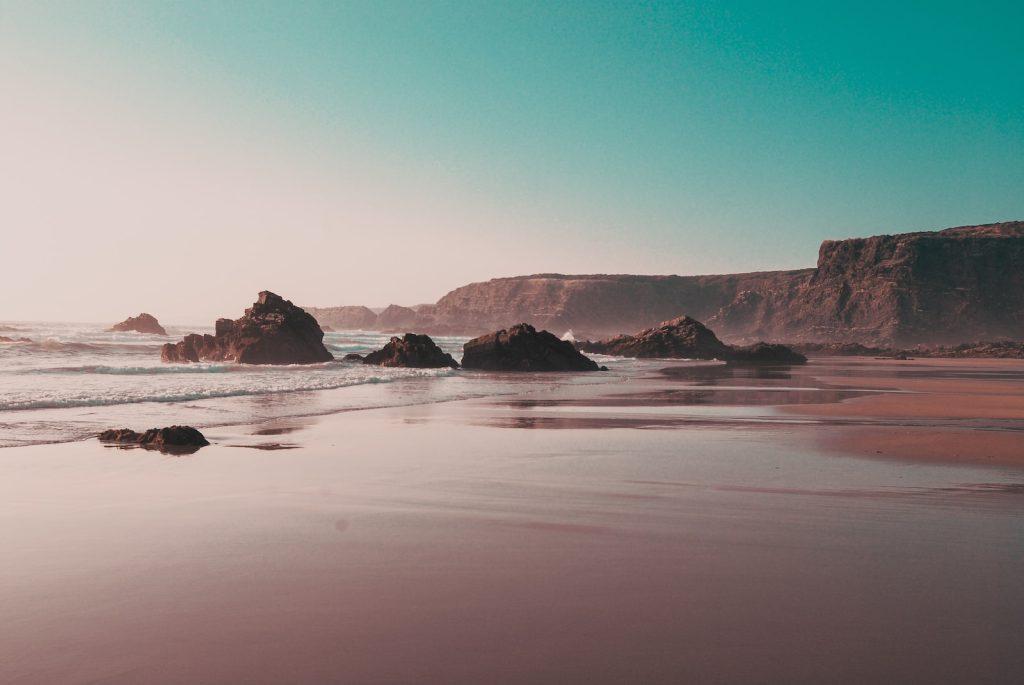 rock formations on seashore during daytime