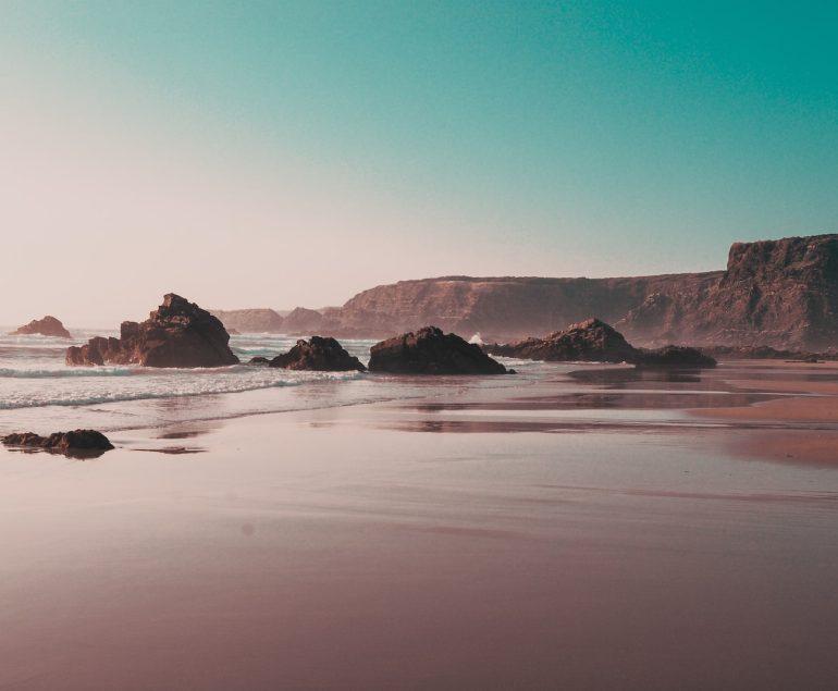 rock formations on seashore during daytime