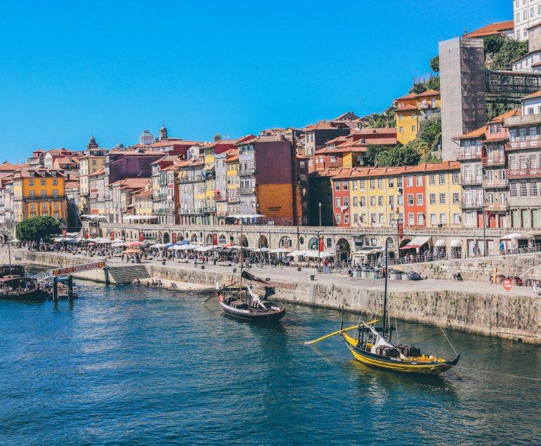 boats docked near seaside promenade]